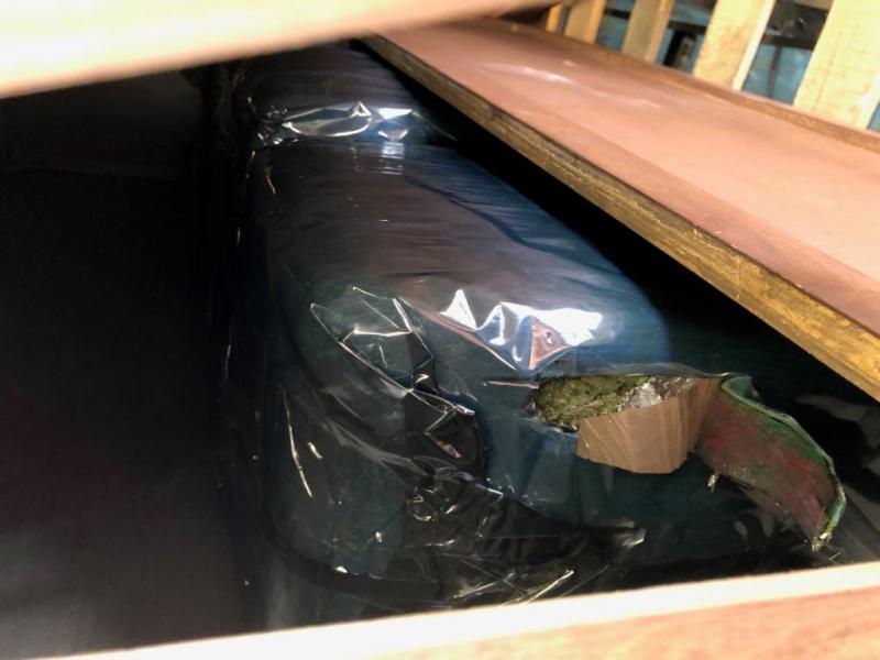 CBP officers assigned to the Tecate cargo facility seized over 2,400 pounds of marijuana comingled in a shipment of wood furniture.