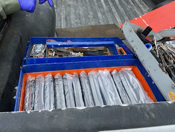 Agents searched the truck and discovered dozens of bundles concealed inside two toolboxes.  