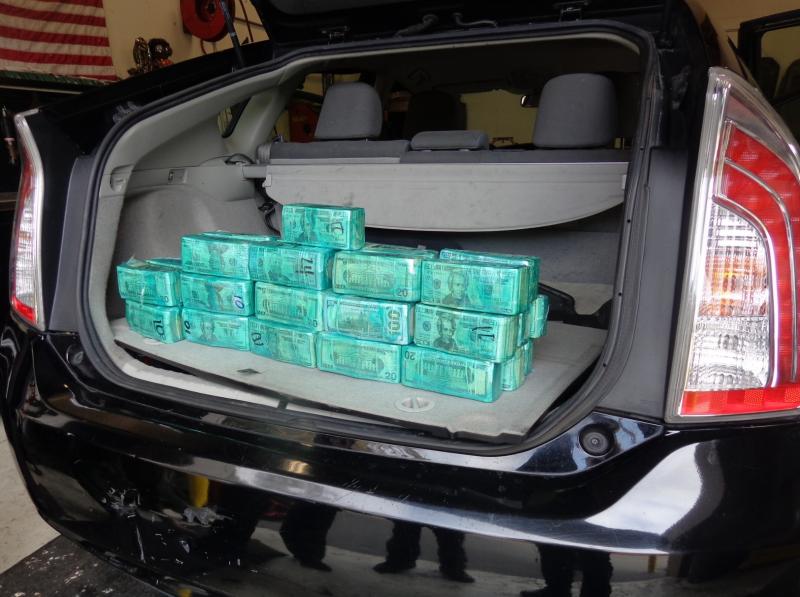 U.S. Border Patrol (USBP) agents arrested a woman in North County San Diego on Tuesday who had 37 bundles of U.S. currency stashed inside her vehicle.