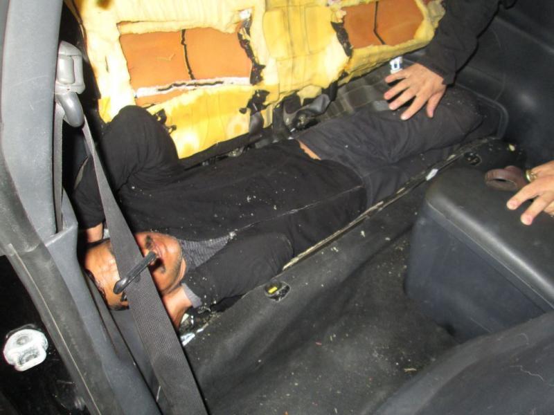 U.S. Customs and Border Protection officers working at the Calexico downtown port of entry found a man concealed inside the rear seat of a car.