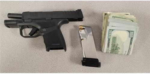 During the inspection, agents found a 9 mm pistol under the front seat and $2,631 on the driver’s person.  