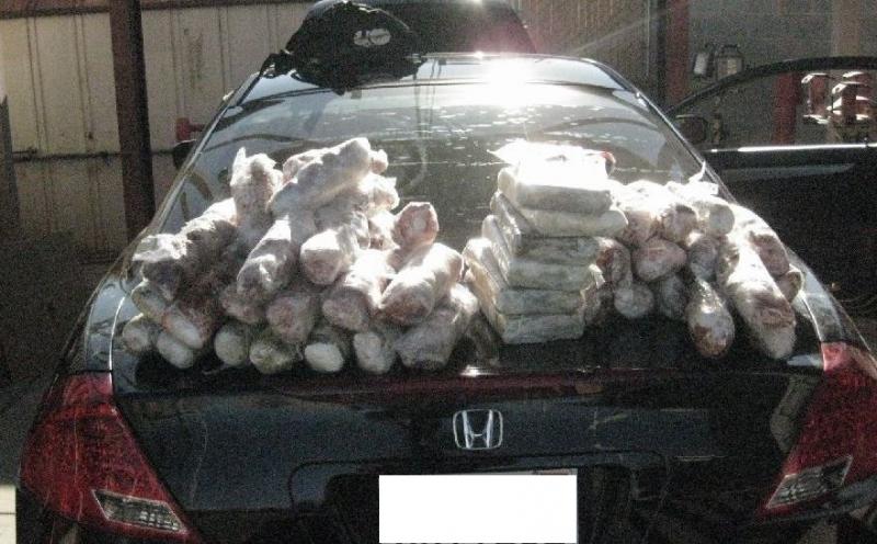 CBP officers pulled 51 packages of hard narcotics from car.