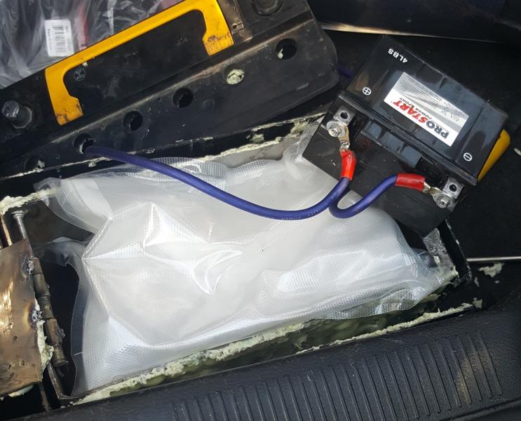 5 lbs. of narcotics stuffed inside modified car battery.