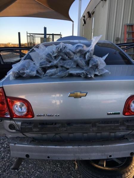 20 bundles of methamphetamine sitting on trunk of a vehicle