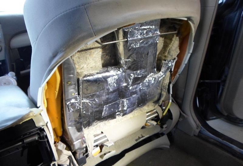 Agents uncover bundles of cocaine stashed inside a vehicle.