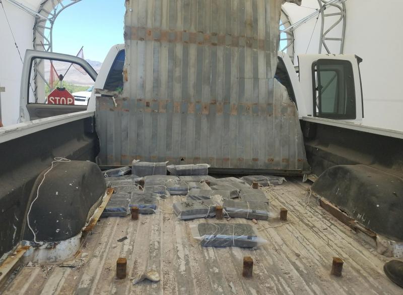 Agents find false floor bed of a pckup loaded with cocaine.