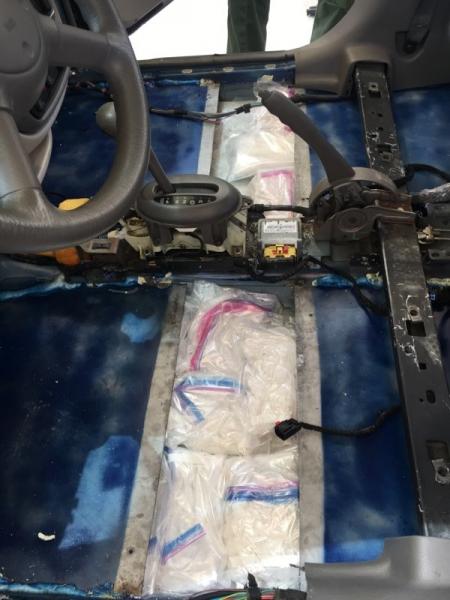 Agents sezied more than 40 pds of meth hidden inside floorboard.