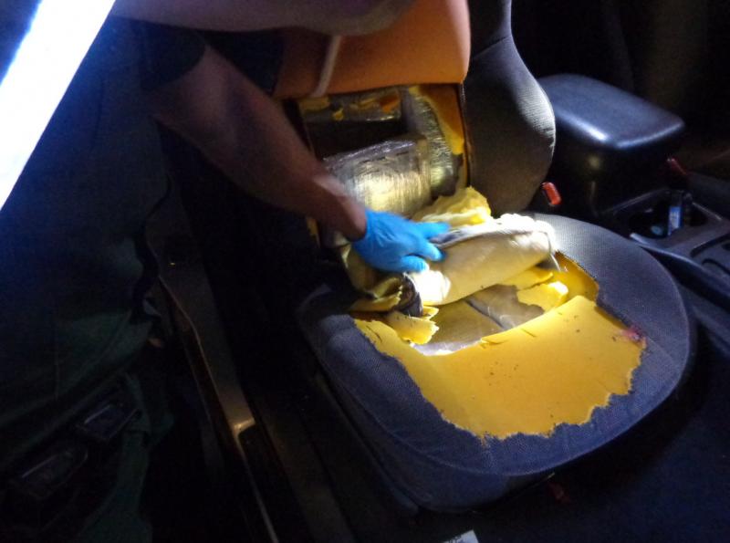 Agents found narcotics stuffed inside two of the car seats.