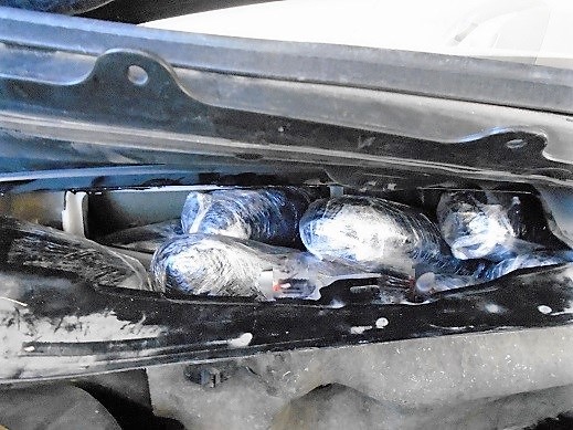 Officers removed nearly 40 packages of meth from the quarter panels and firewall 