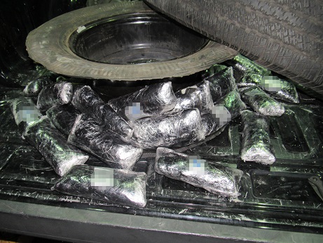 Drug smugglers attempted to hide drugs within the spare tire of a smuggling vehicle 