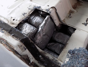 A combination of drugs was found in the floorboard of a smuggling vehicle