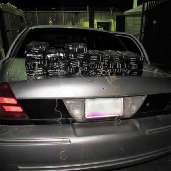 Officers removed 54 pounds of cocaine from the trunk of a smuggling vehicle