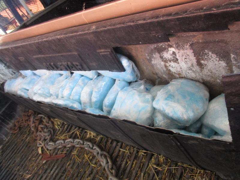 A CBP narcotics detection canine alerted to 76 pounds of meth, concealed in a false truck bed wall