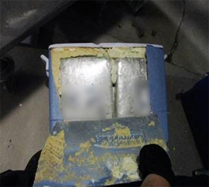 Officers discovered packages of marijuana within the shell of an ice chest