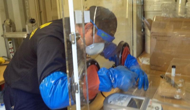 CBP officers donned protective clothing to make the seizure and identification process of the drugs