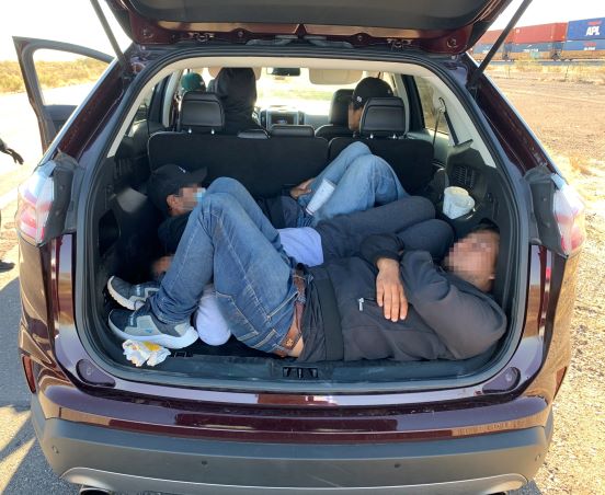 Agents arrested 5 migrants after stopping a vehicle near Wellton. Two suspected smugglers were also taken into custody