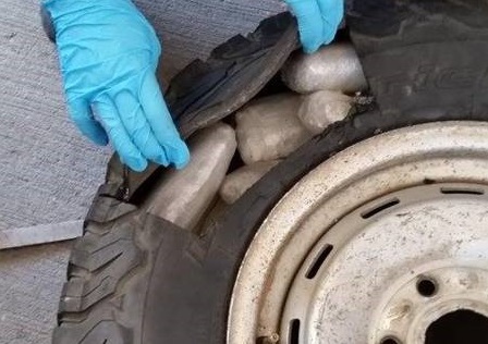 Fentanyl, meth and heroin were removed from the rear cabin wall and spare tire of a smuggling vehicle 
