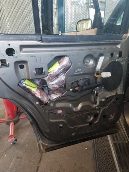 Officers removed packages from all four doors of a smuggling vehicle