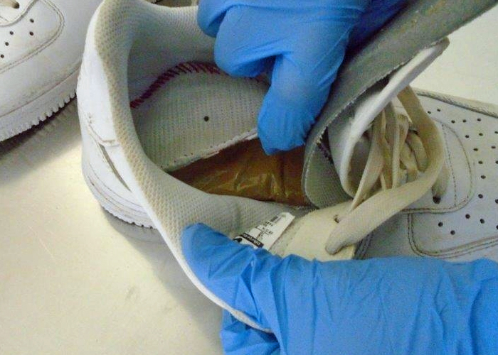 When Officers at the DeConcini pedestrian crossing searched the shoes of a border crosser, they found more than two pounds of heroin inside
