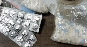 A combination of pills were removed from a bottle as well as the undergarments of a suspected smuggler
