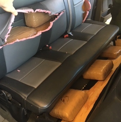 Agents removed packages of marijuana from the seats of a smuggling vehicle