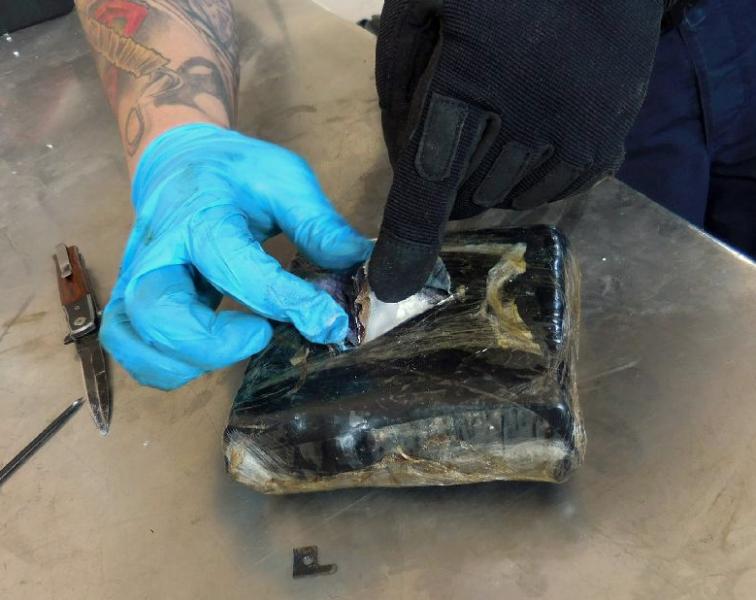 Packages of drugs recovered from a smuggling vehicle are determined to be nearly 23 pounds of cocaine