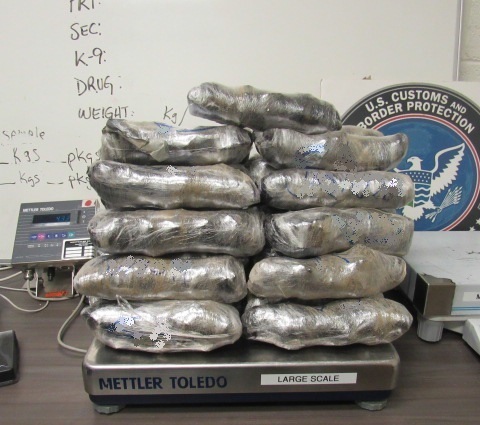 Officers removed packages of meth from within the door panels of a smuggling vehicle