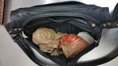Officers uncovered a pair of packages of meth inside of a subject's purse