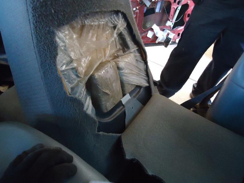 Officers removed packages of marijuana from the seats of a smuggling vehicle