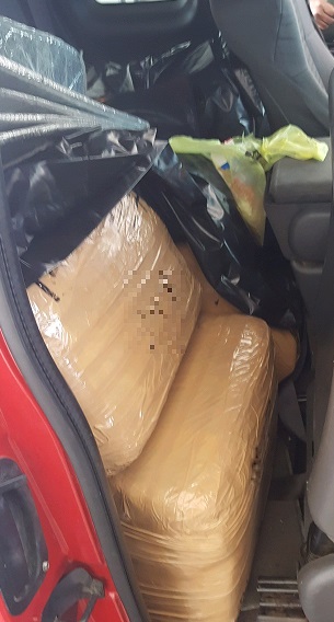 Agents found bundles of marijuana behind the seats of a smuggling vehicle