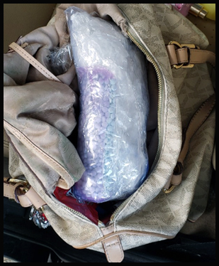 Agents seized fentanyl, along with meth, currency & a firearm