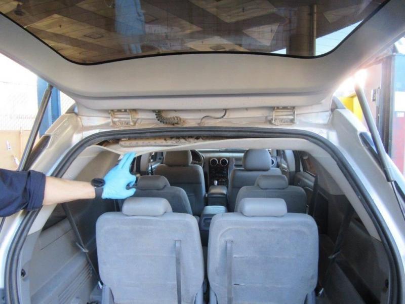 Officers discovered and seized 26 pounds of cocaine from within the headliner of a smuggling vehicle