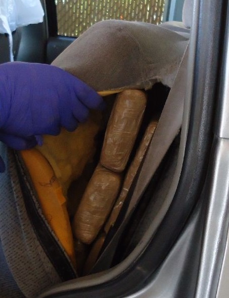 Drug smugglers attempted to hide packages of marijuana from within the rear quarter panels 