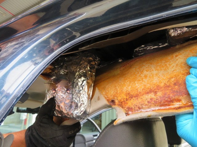 Officers removed more than 33 pounds of meth from the roof of a smuggling vehicle