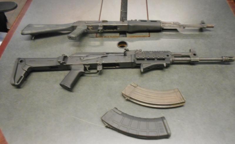 Smugglers attempted to hide 2 AK-47 rifles beneath the front car mats of a smuggling vehicle