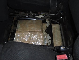 Officers removed more than 250 packages of marijuana from smuggling vehicle