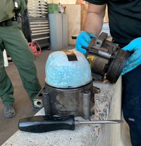 A CBP canine alerted agents to the discovery of fentanyl inside of a smuggling vehicle's a/c compressor.