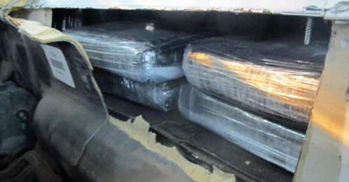 cocaine within a hidden compartment inside of a smuggling vehicle