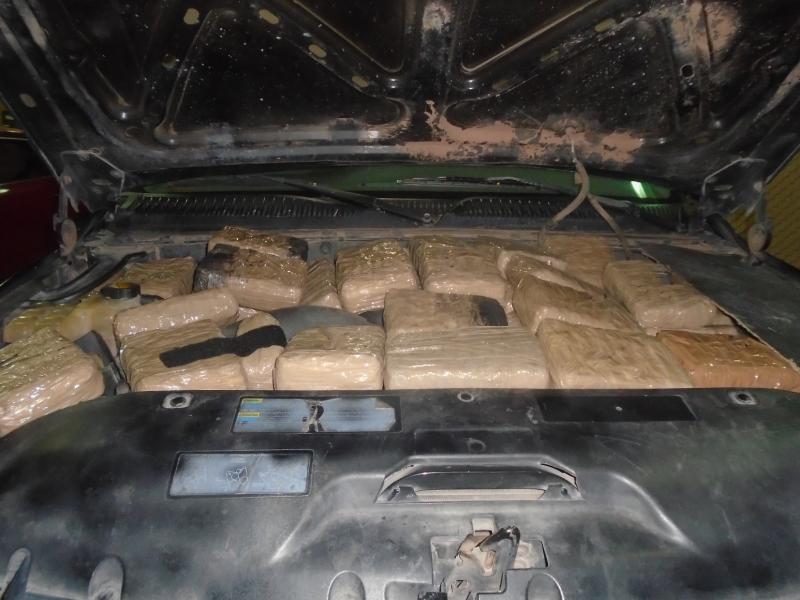 Nearly 300 packages of marijuana were discovered throughout a smuggling vehicle
