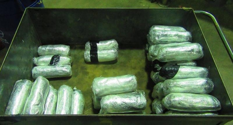 Officers removed more than 57 pounds of meth from the trunk of a smuggling vehicle