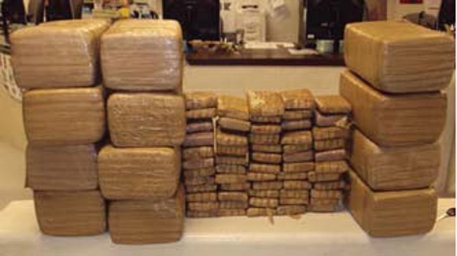 The military-style duffels yielded 335.6 pounds of marijuana worth $268,480.00.