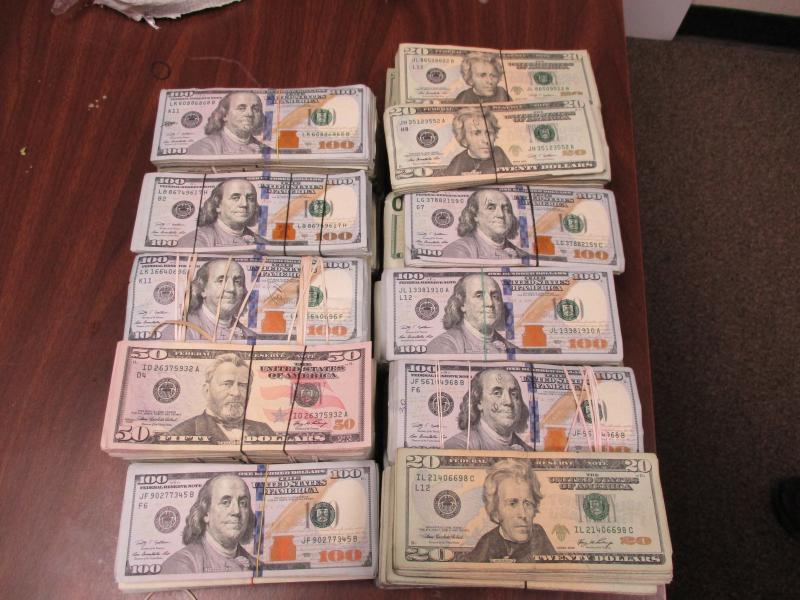 Stacks of bills totalling $163,130 in unreported currency seized by CBP officers at Hidalgo International Bridge