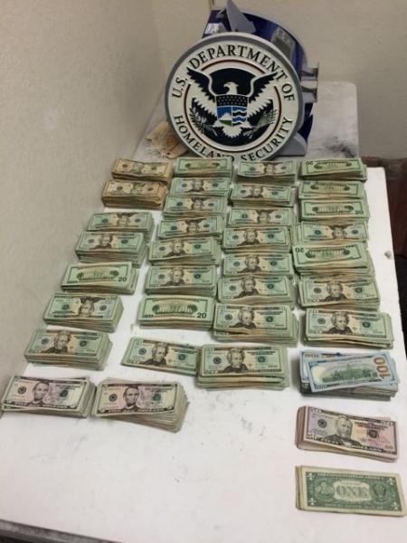 Stacks of bills totaling $136,000 in un reported currency seized by CBP officers at Laredo Port of Entry