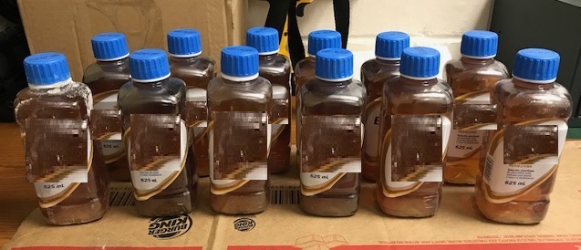 Bottles containing a total of 18 pounds of liquid meth seized by CBP officers at Laredo Port of Entry