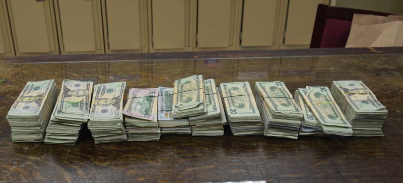 Stacks containing $106,000 in unreported currency seized by CBP officers at Brownsville Port of Entry.