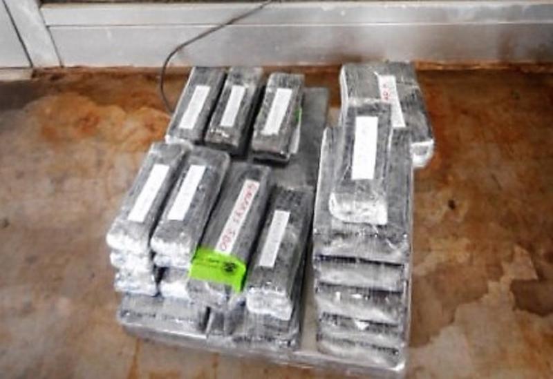 Paquetes que contienen 51 libras de heroína decomisada por oficiales de CBP en Puente Internacional Pharr-Reynosa