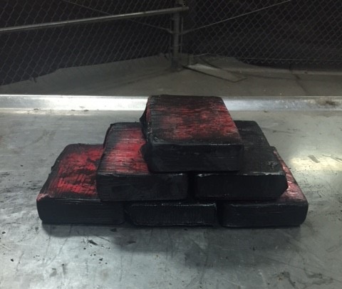 Six bundles containing a total of 7.49 pounds of heroin seized by CBP officers at Laredo Port of Entry
