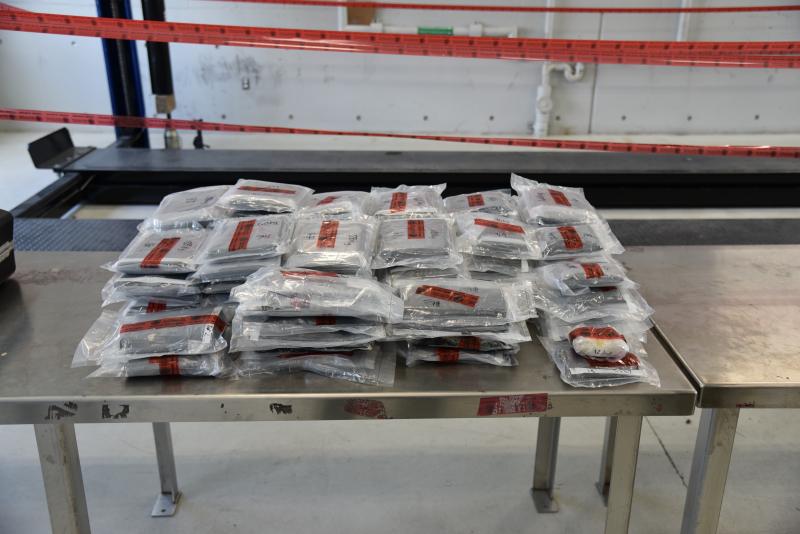 Packages containing 94 pounds of methamphetamine and more than three pounds of heroin seized by a CBP officer at Laredo Port of Entry