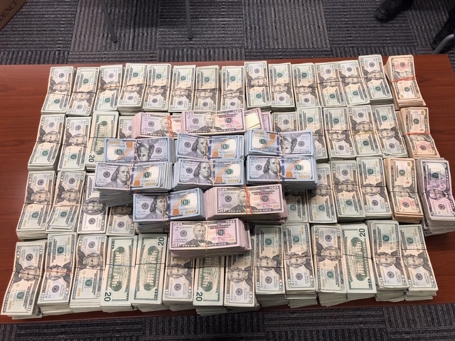 Stacks of bills containing $988,550 in unreported currency seized by CBP officers at Laredo Port of Entry