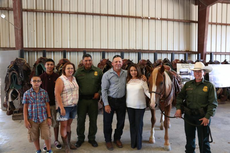 Acting RGV Sector CPA Raul Ortiz poses with the Vega family and Mustang 